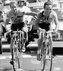 Lemond and Hinault enjoy a rare moment of camaraderie on the '86 Tour, when Lemond lets Hinault win a stage with the understanding that Hinault would let him win the Tour 